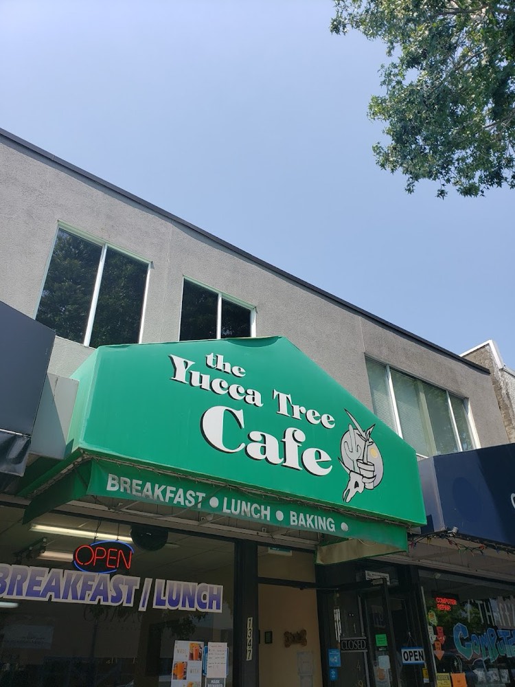 The Yucca Tree Cafe storefront on Johnston Road, with a green awning reading Breakfast, Lunch, Baking